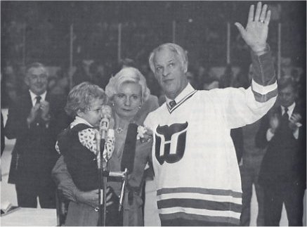 Gordie Howe and wife Colleen watch as Gordie's number 9 is retired